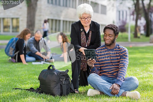 Image of College Professor helping Student