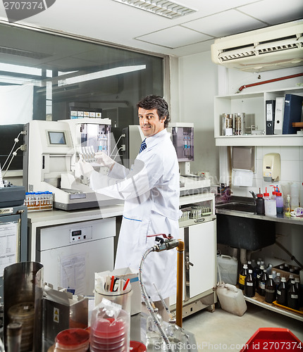 Image of Scientist Analyzing Urine Samples In Laboratory