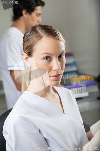 Image of Female Lab Technician With Colleague