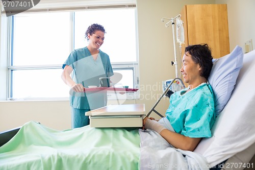 Image of Nurse Bringing Breakfast For Patient In Hospital