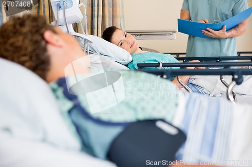 Image of Patient's Looking At Each Other In Hospital Ward