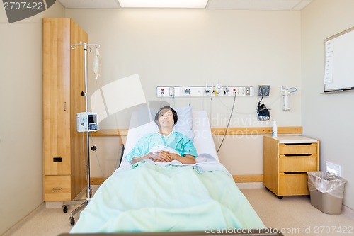 Image of Patient Reclining On Bed While Looking Up In Hospital