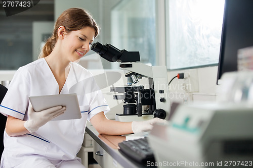 Image of Researcher Holding Digital Tablet In Laboratory