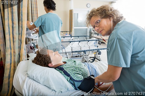 Image of Nurse Checking Patient's Blood Pressure