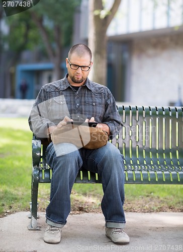 Image of University Student Using Digital Tablet At Campus