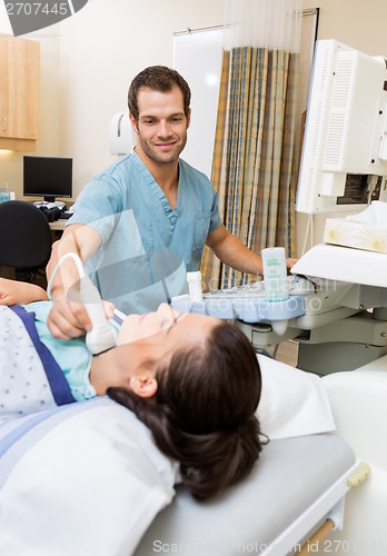 Image of Nurse Performing Ultrasound On Patient's Neck