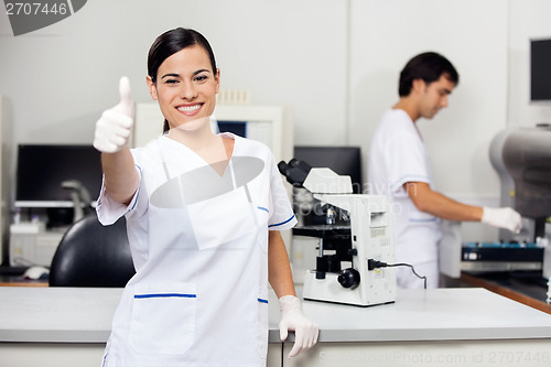 Image of Scientist Gesturing Thumbs Up In Laboratory