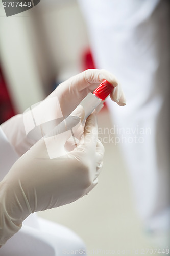 Image of Technician Labeling Test Tube In Lab