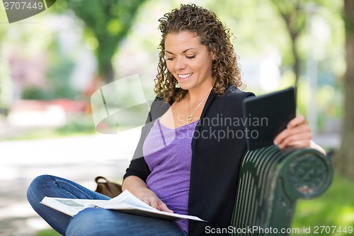 Image of University Student Reading Book At Campus