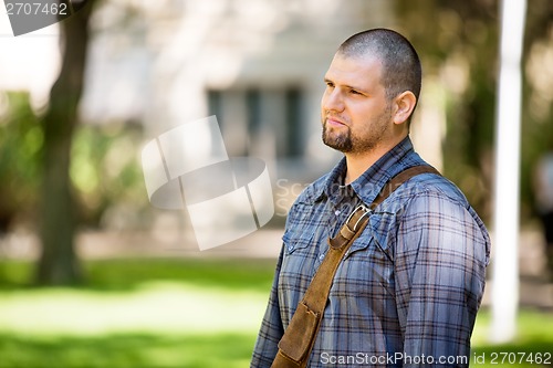 Image of Thoughtful Student Standing At Campus