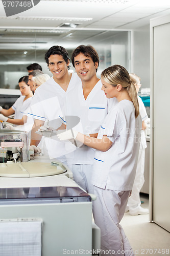 Image of Researchers With Colleagues In Laboratory