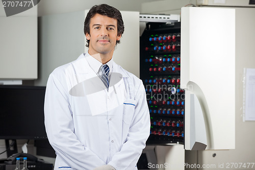 Image of Researcher Standing By Blood Culture Instrument