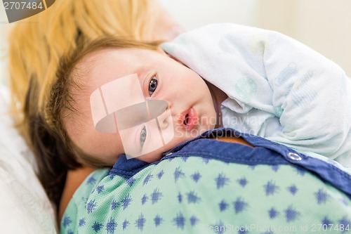 Image of Cute Babygirl Resting On Mother's Shoulder In Hospital