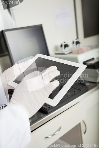 Image of Researcher Using Tablet Computer In Lab