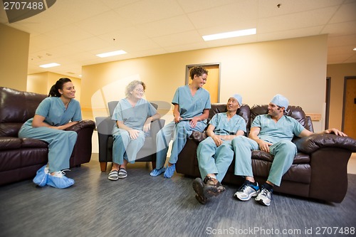 Image of Medical Team Conversing In Hospital's Waiting Room