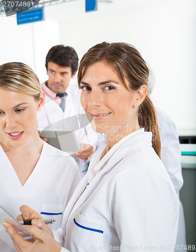 Image of Researcher With Colleague In Laboratory