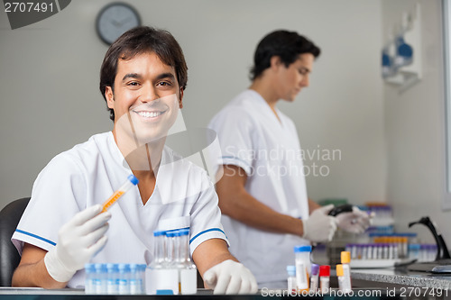 Image of Technician Analyzing Sample In Lab