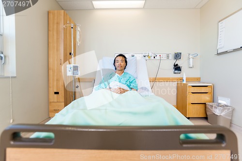 Image of Portrait Of Male Patient Reclining On Hospital Bed