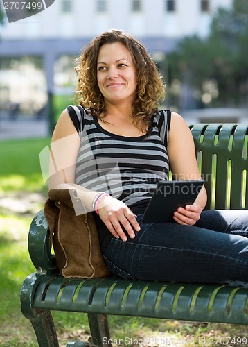 Image of Thoughtful University Student Relaxing On Bench