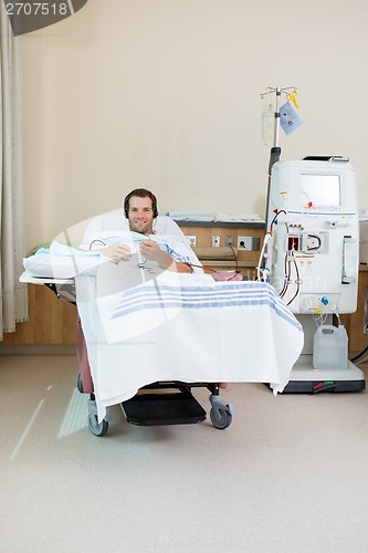 Image of Patient Listening Music While Receiving Renal Dialysis