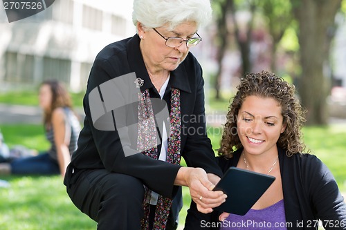 Image of Female Professor Helping Grad Student