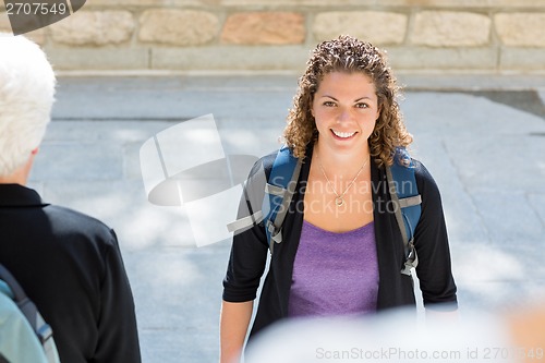 Image of Student With Backpack Standing On College Campus