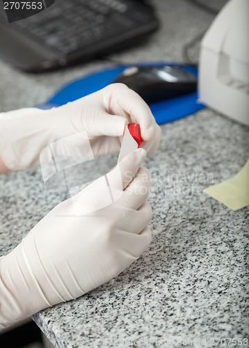 Image of Lab Technician Labeling Test Tube