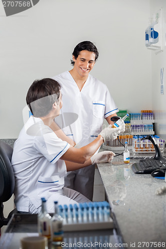 Image of Technicians Scanning Barcode On Specimen