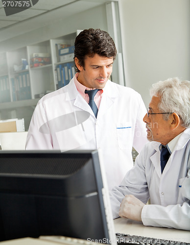Image of Technicians Discussing In Laboratory