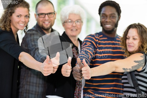 Image of Students and Professor Showing Thumbs Up