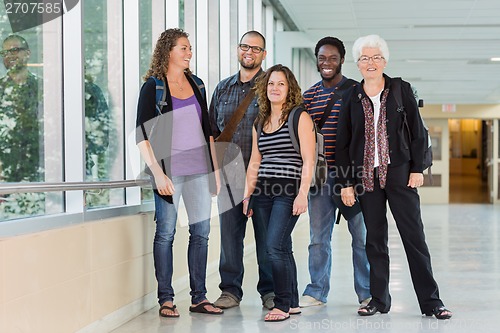 Image of Happy Multiethnic University Students At Corridor