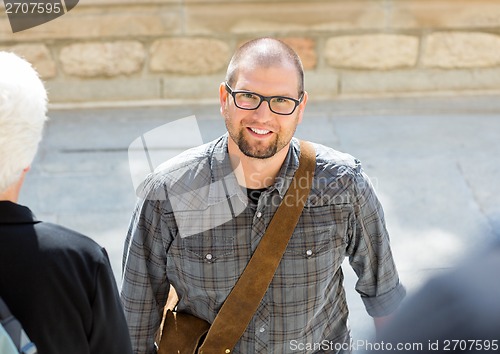 Image of Smiling Male Student With Bag Standing On Campus