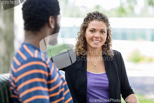 Image of Beautiful Student Sitting With Classmate On Campus