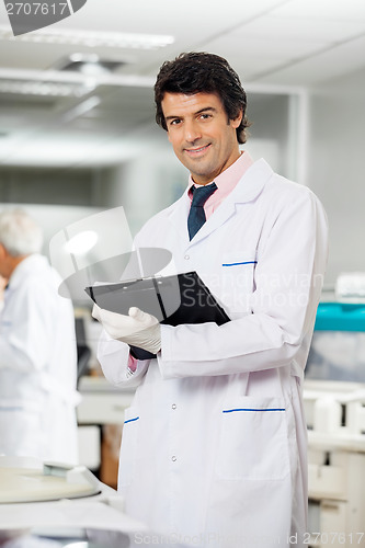 Image of Technician With Clipboard In Laboratory