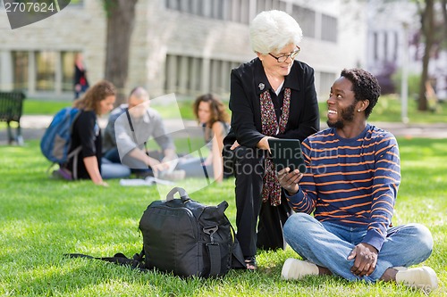 Image of Professor and Student Working Together Outdoors