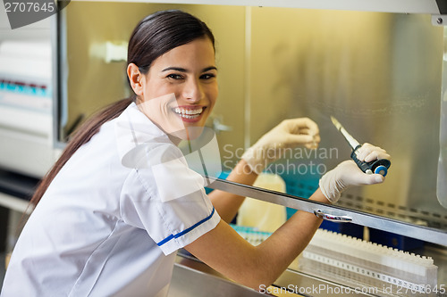 Image of Female Researcher Experimenting In Laboratory