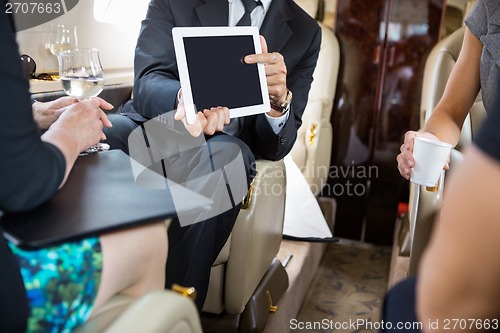 Image of Business Partners Working In Private Jet