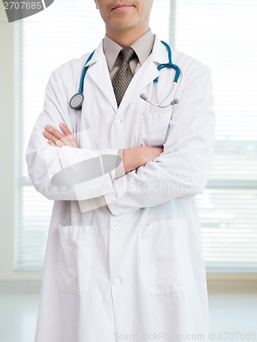 Image of Cancer Specialist With Stethoscope Around Neck Standing In Hospi