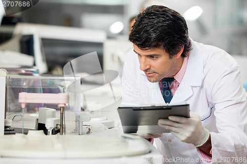 Image of Scientist Observing Experiment