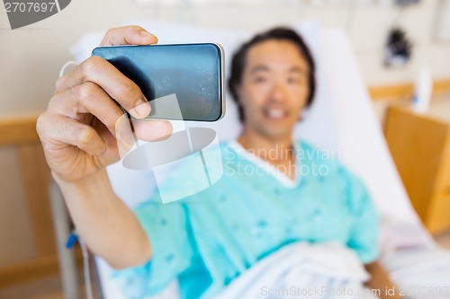 Image of Patient Taking Self Portrait Through Mobile Phone In Hospital
