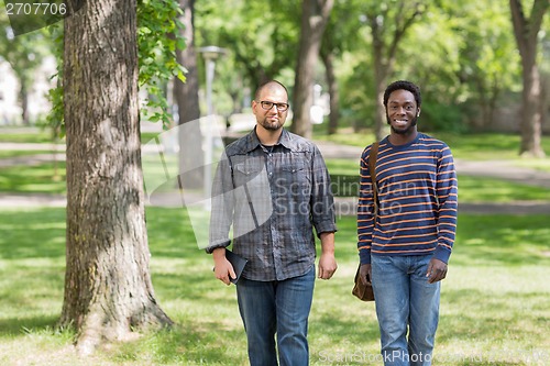 Image of Confident Grad Students Walking On University Campus