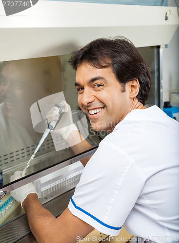 Image of Researcher Filling Chemical In Testtube