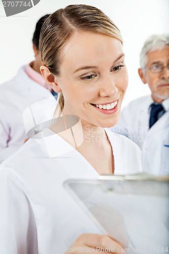 Image of Technician Looking At Clipboard