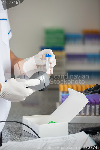 Image of Technician Scanning Barcode On Medical Sample