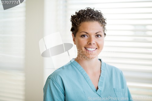 Image of Happy Female Nurse In Scrubs