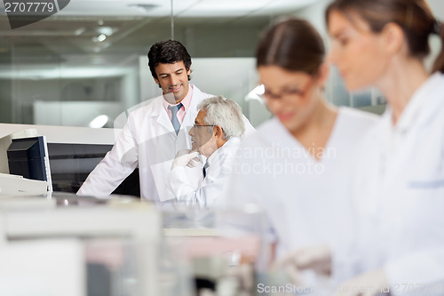 Image of Male Technicians Discussing In Lab