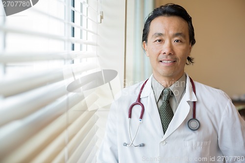 Image of Doctor With Stethoscope Around Neck In Hospital Room