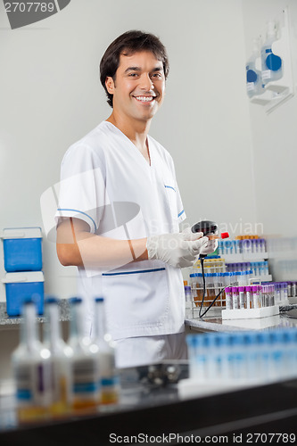 Image of Man Scanning Barcode On Specimen