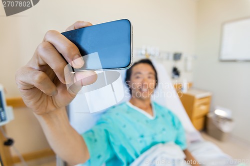 Image of Male Patient Taking Self Portrait Through Mobile Phone In Hospit