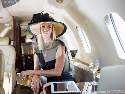 Image of Rich Woman Sitting In Private Jet